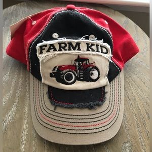 CNH Inc. Farm Kid hat - red baseball hat with sewn-on logo and tractor picter